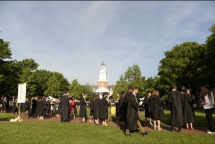 Graduates walking across campus.